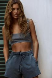 FADED-EFFECT RIBBED CROP TOP WITH RIPS