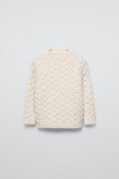 CABLE-KNIT SWEATER